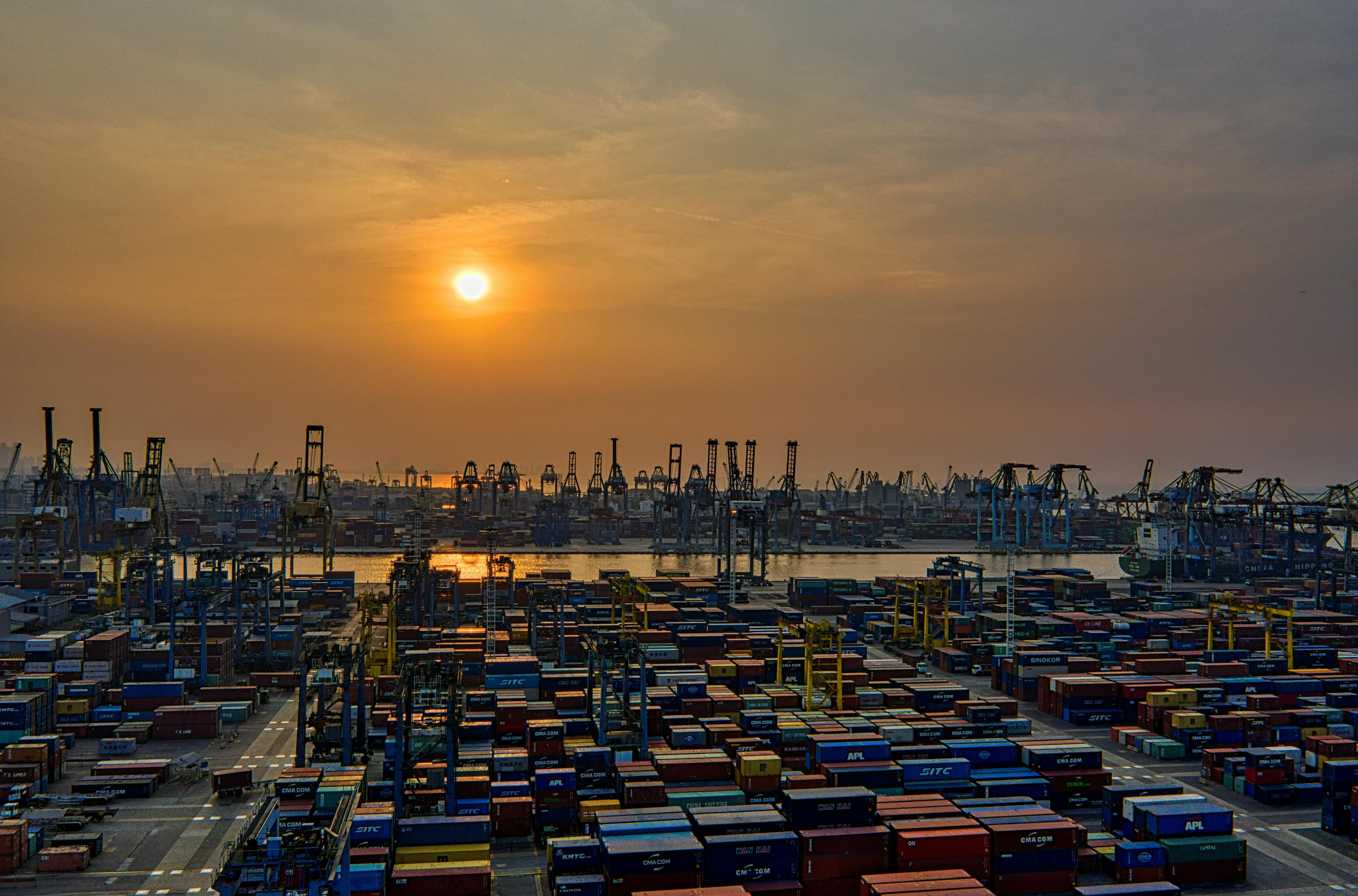 A container harbour at sunset